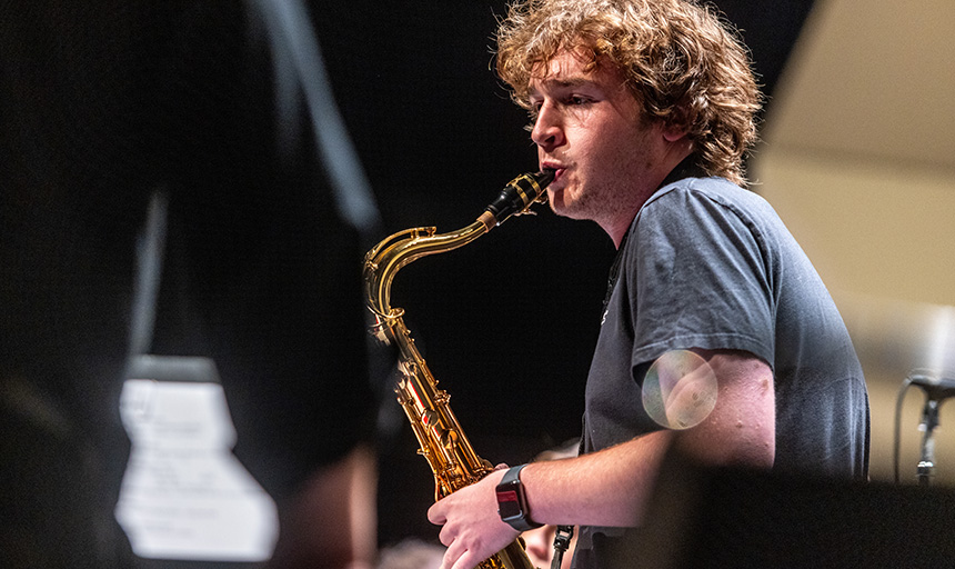 Photo of band member playing saxophone