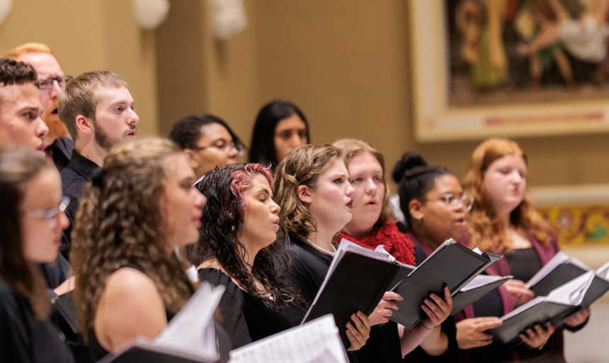 choir members singing at a past concert