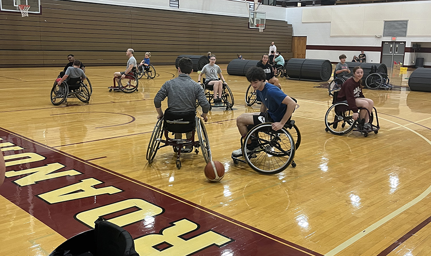 Students playing wheelchair basketball