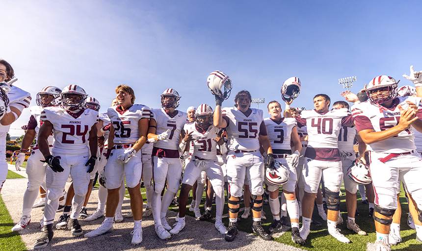 football players wearing white uniforms