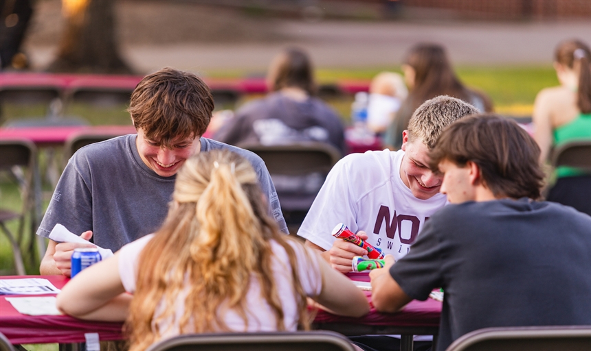 students smiling while playing Bingo
