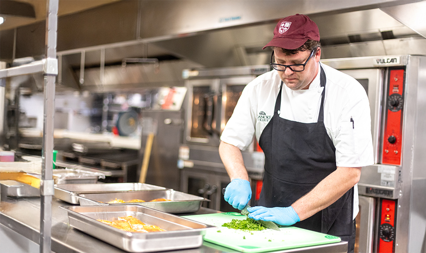 Roaoke College chef preparing food in the kitchen