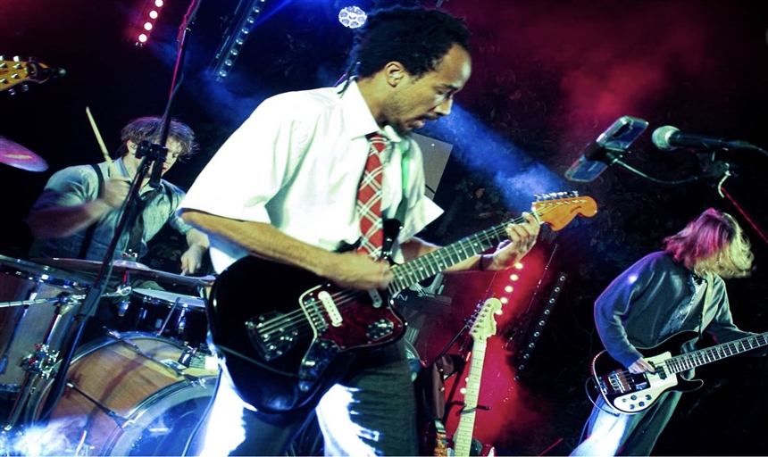 photo of people playing in a band 