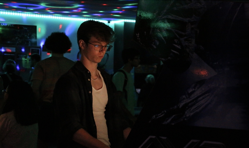 photo of a man playing a video game 