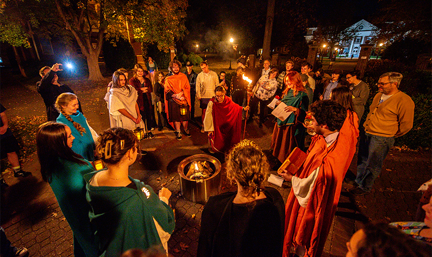 History homecoming - students gathered around a fire pit