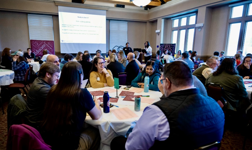 People holding discussions at small tables