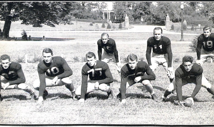 A black and white photo of eight men from the 1936 Roanoke College football team, posed for a photo in the yearbook.