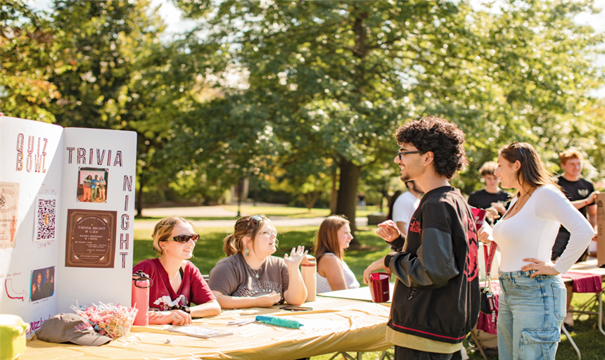 Photo of student at the activities fair for Quiz Bowl