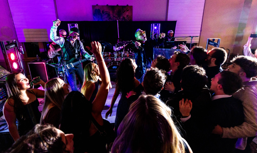 Students dancing while a band plays