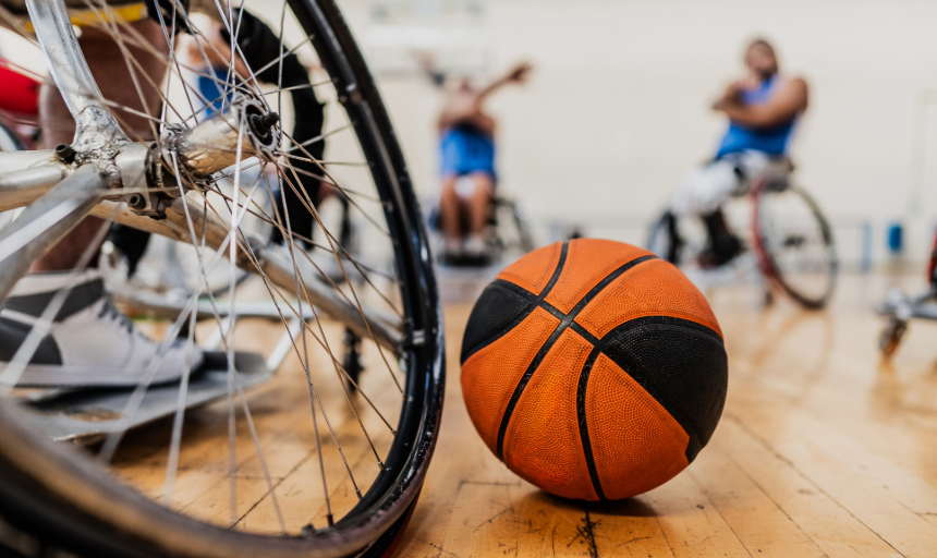 Closeup of a basketball and a sports wheelchair