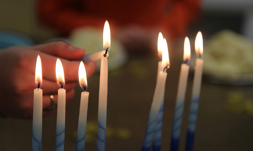 Picture of menorah candles being lit