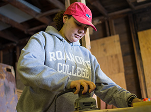 a student working with habitat for humanity