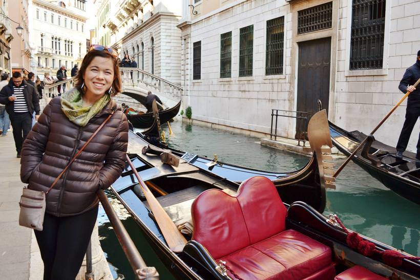 Student by a gondola in Venice
