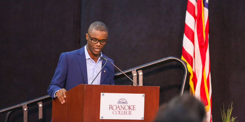 Myles Cooper, president of the Roanoke College Democrats, addresses the audience.