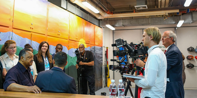 A behind the scenes look of regional media interviewing Sam Rasoul and Jesse Jackson.