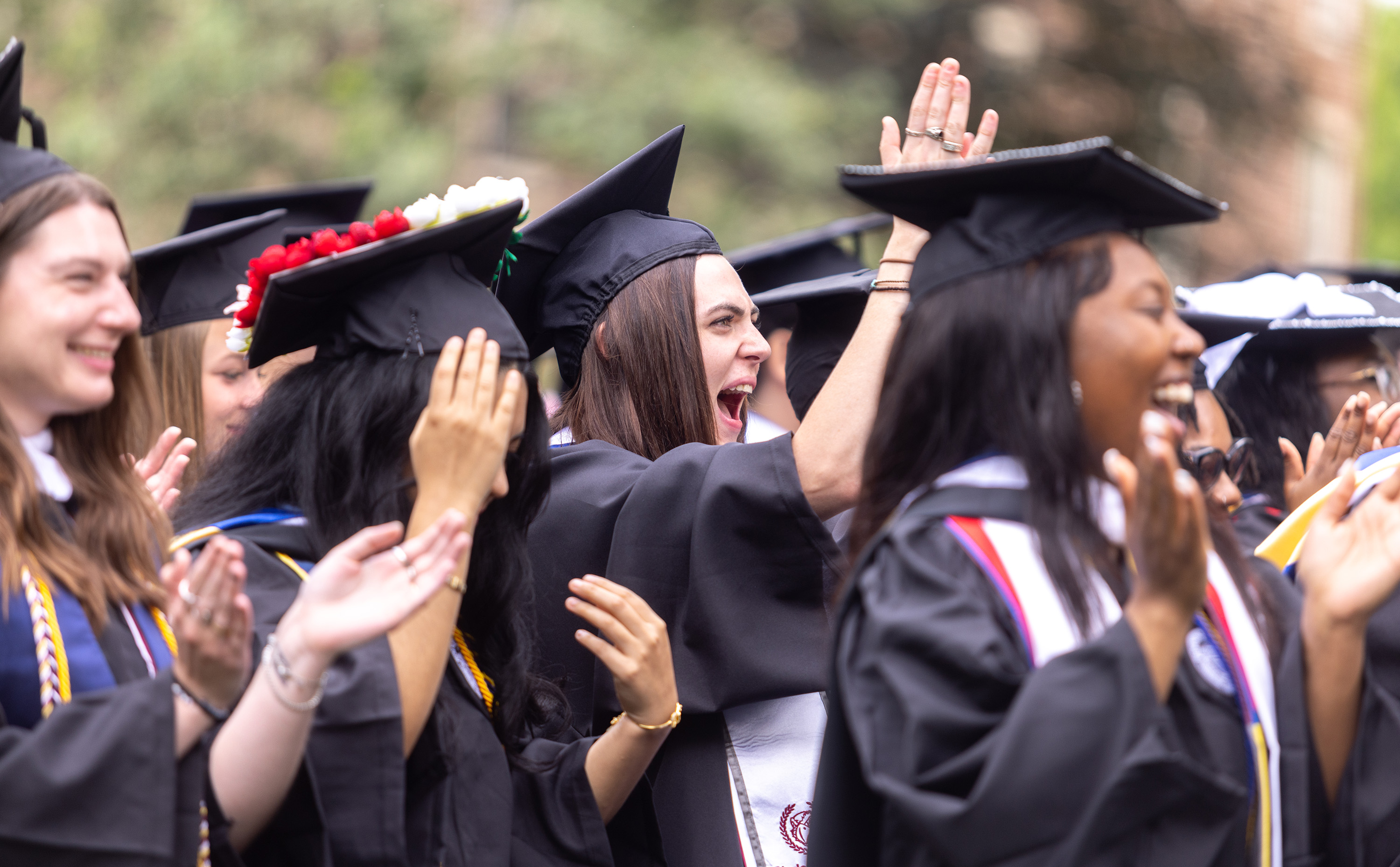 Students at commencement cheering