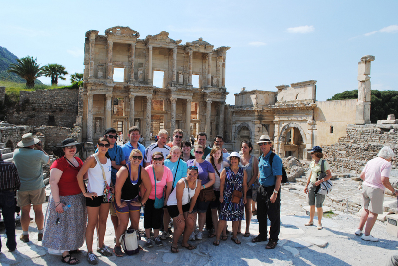 Students by ancient ruins