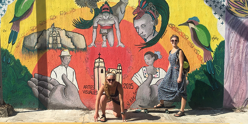 Students in front of a mural