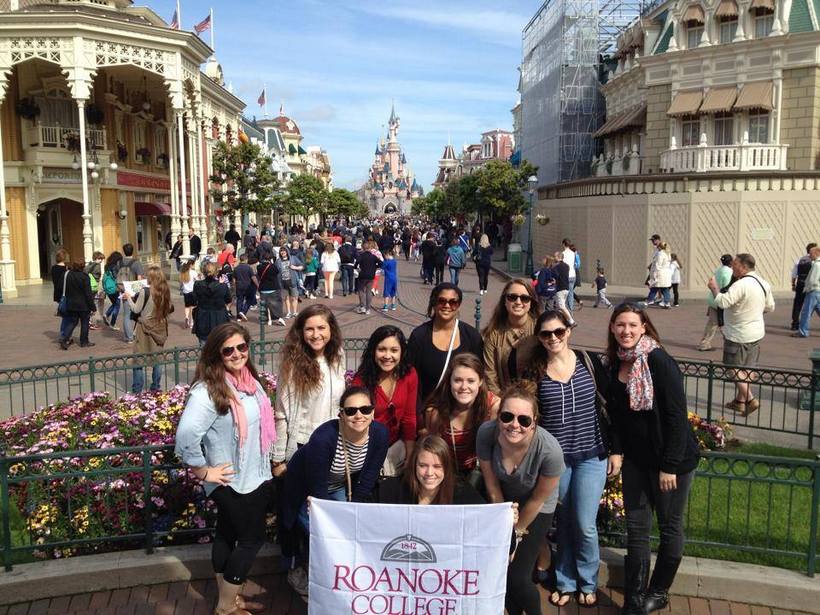 Students at Disneyland Paris with a Roanoke College banner