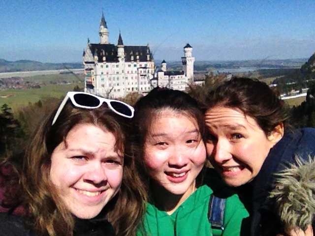 Selfie of students with a castle in the background