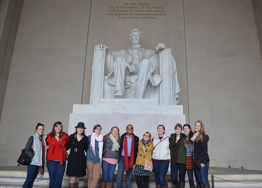Students posing in front of the Lincoln memorial