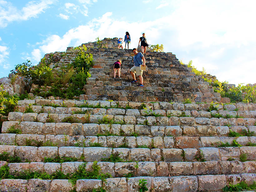 Students climbing ruins in the Yucatan