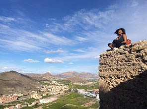 Student above ruins in peru