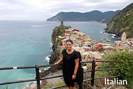 Roanoke student standing with a view of Cinque Terre 