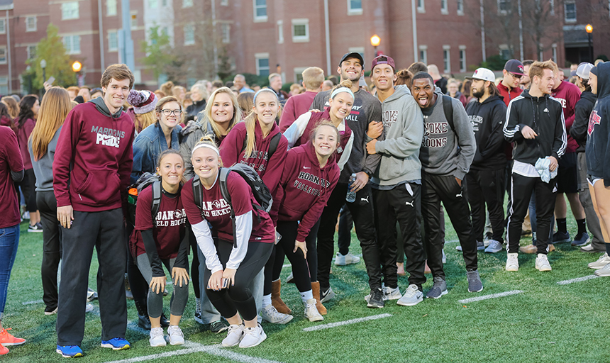 Students posing for photo on Kerr Stadium