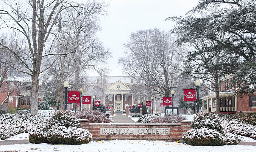 A photo of the administration building, the Heritage Walk, and the Roanoke College sign in the snow