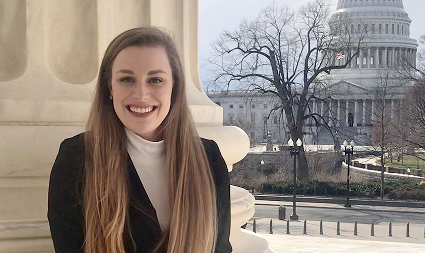 Bekah Carey pictured in Washington DC with column behind her