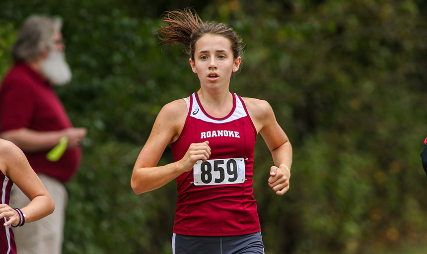 Woman running in Roanoke uniform