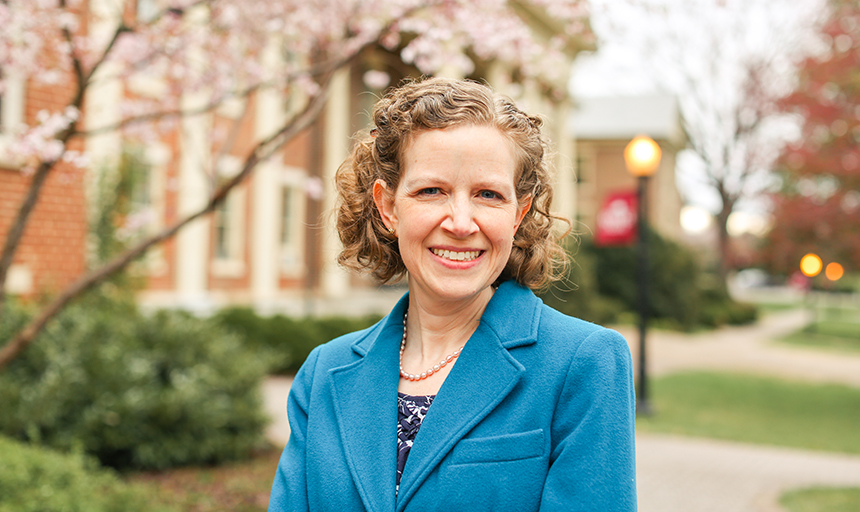 Female professor on campus in spring