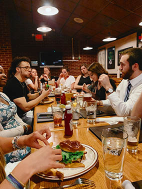 Students eating at a restaurant after the mock ceremony