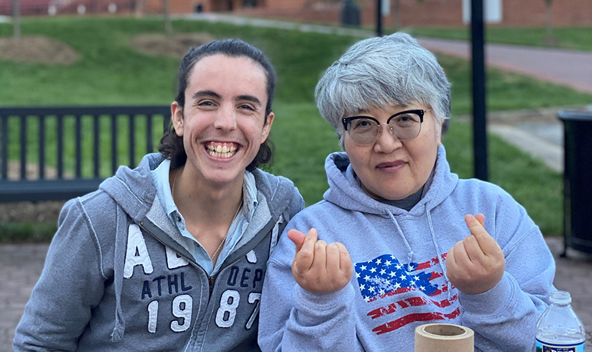 Two students smiling on campus