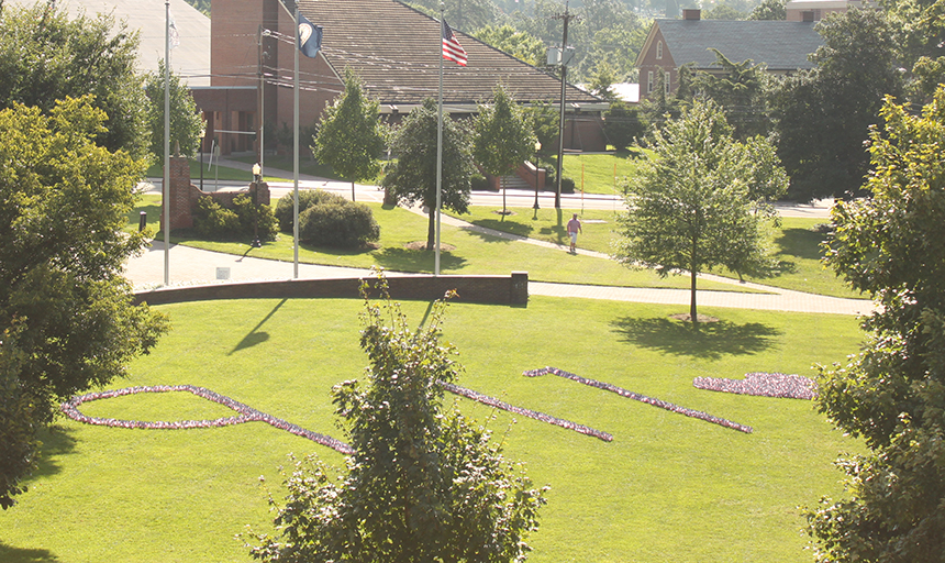 flags placed on Back Quad in shape of 9-11 with heart 