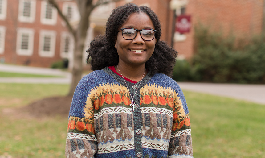 Young woman smiling on campus