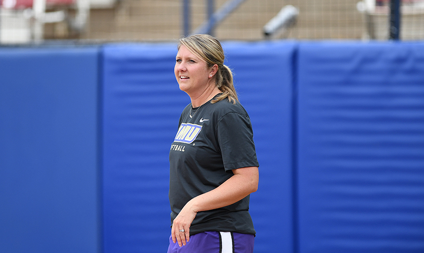Woman smiling while coaching team