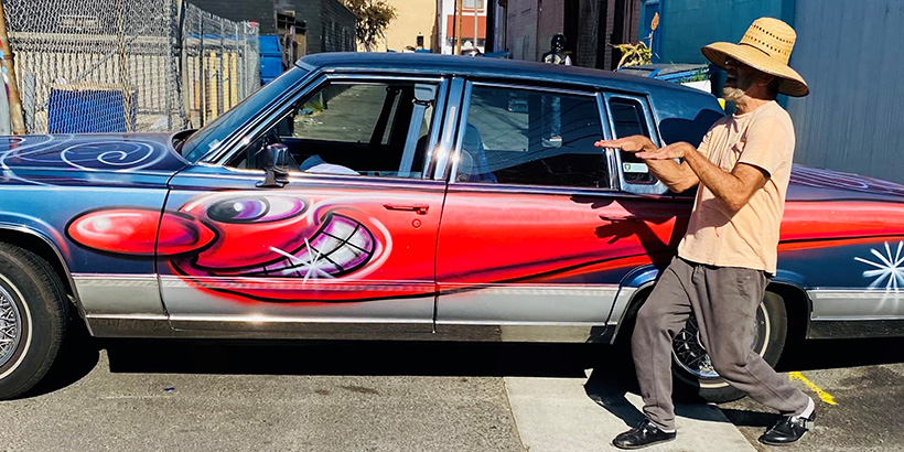 Kenny Scharf spray paints art on to car