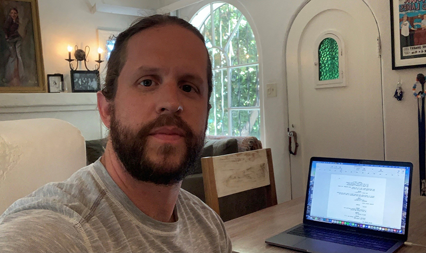 Phillip Murphy in his living room writing space