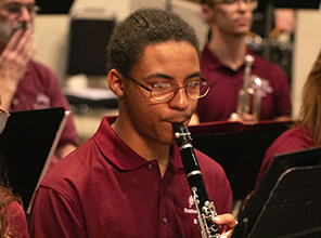 student playing instrument