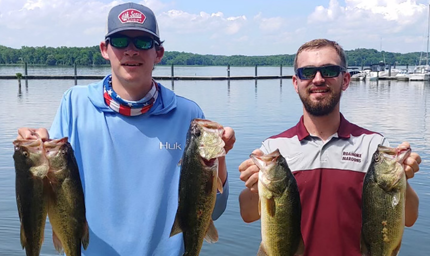 two men holding fish