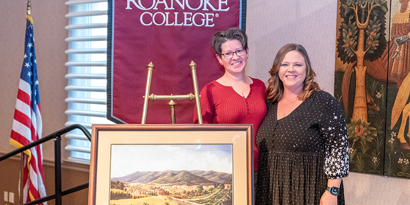 Dr. Frances McCutcheon with Laura Tucker and Roanoke College banner behind them