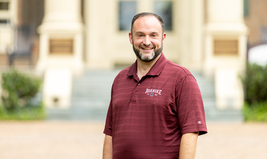 David Taylor stands in front of Administration Building