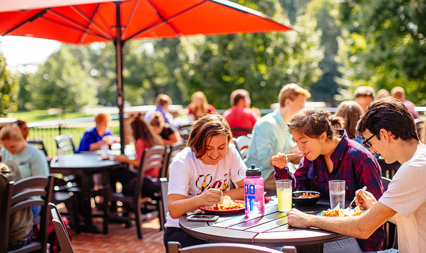 Students enjoy a meal on the Colket patio.