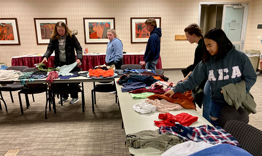 Students look at merchandise on tables in the Free Store