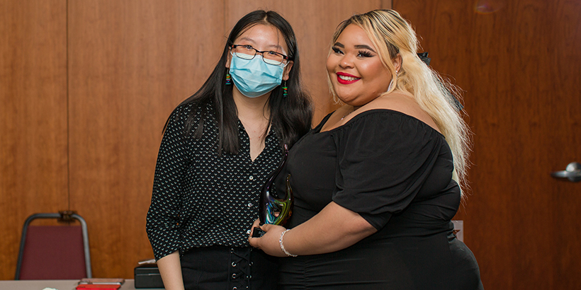 two people holding award