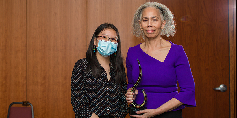 two people holding award