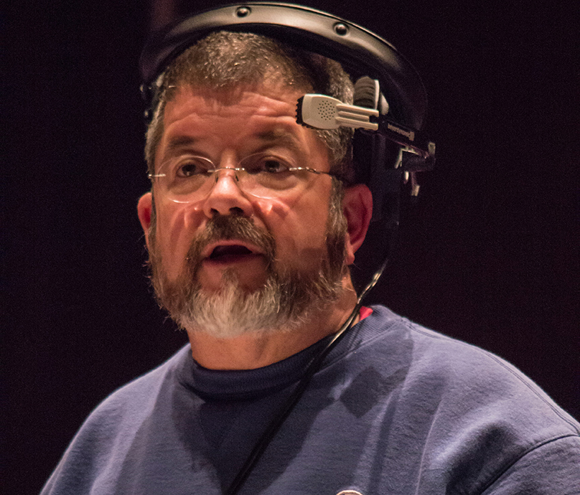 George Arthur with beard and headset