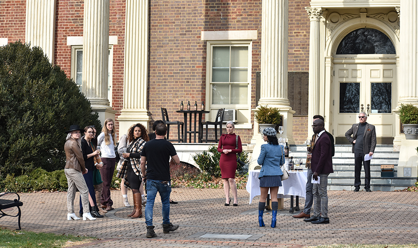 cast and crew in front of administration building
